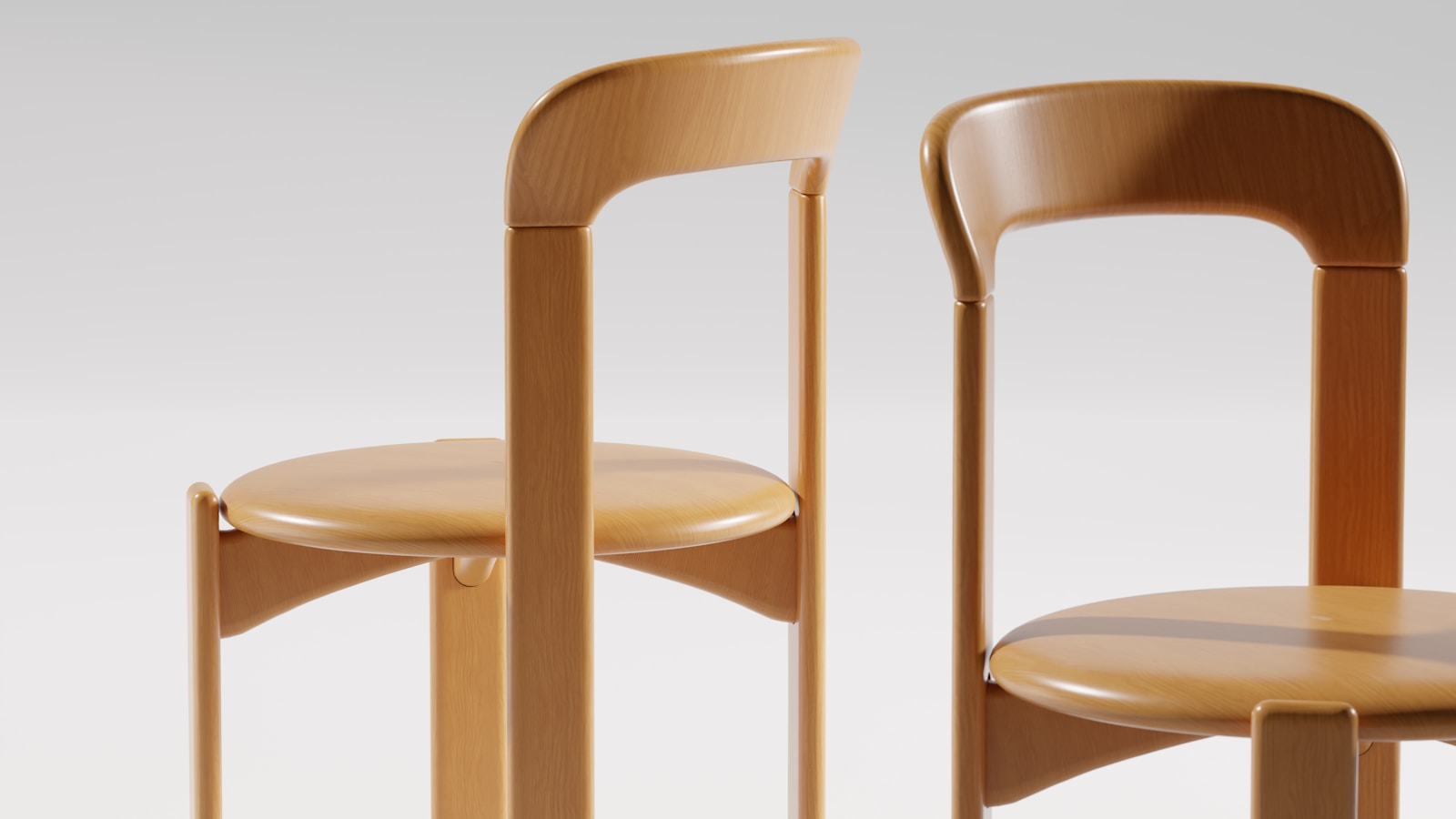 Two wooden chairs stand side by side.