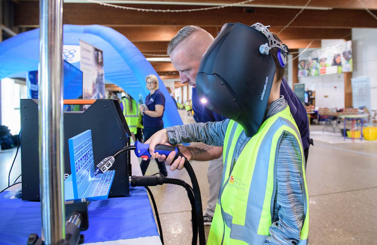 A pupil having a go with the welding simulator with PJD at Construction & Engineering Week 20