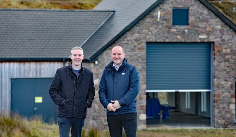 Caithness, Sutherland and Ross MSP David Green and Bakkafrost Scotland managing director Ian Laister in front of the hydro power house.