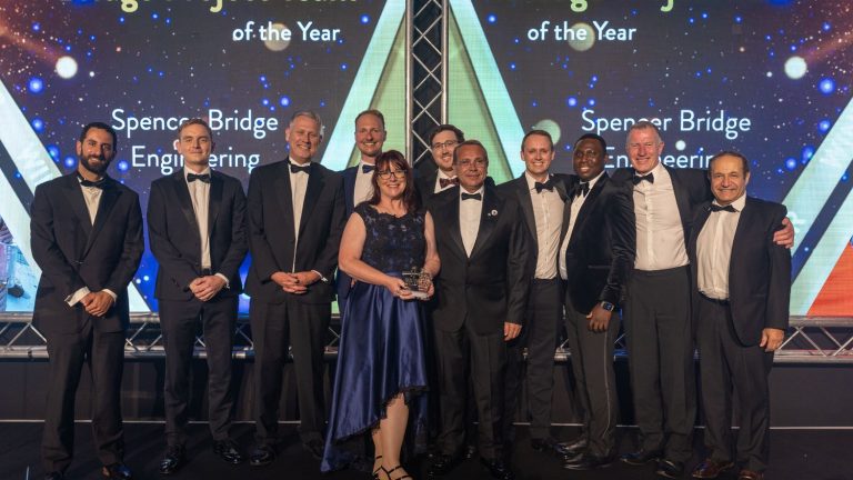 The winning Spencer Bridge Engineering team with, left, Sotiris Kanaris, of awards organiser New Civil Engineer, and, centre, Kerry Evans, representing UK Highways A55 Ltd, and Gary Moore, from Menai Suspension Bridge Asset Manager Vercity Group. Credit: NCE