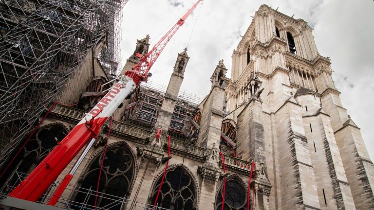 a large cathedral under construction with scaffolding around it